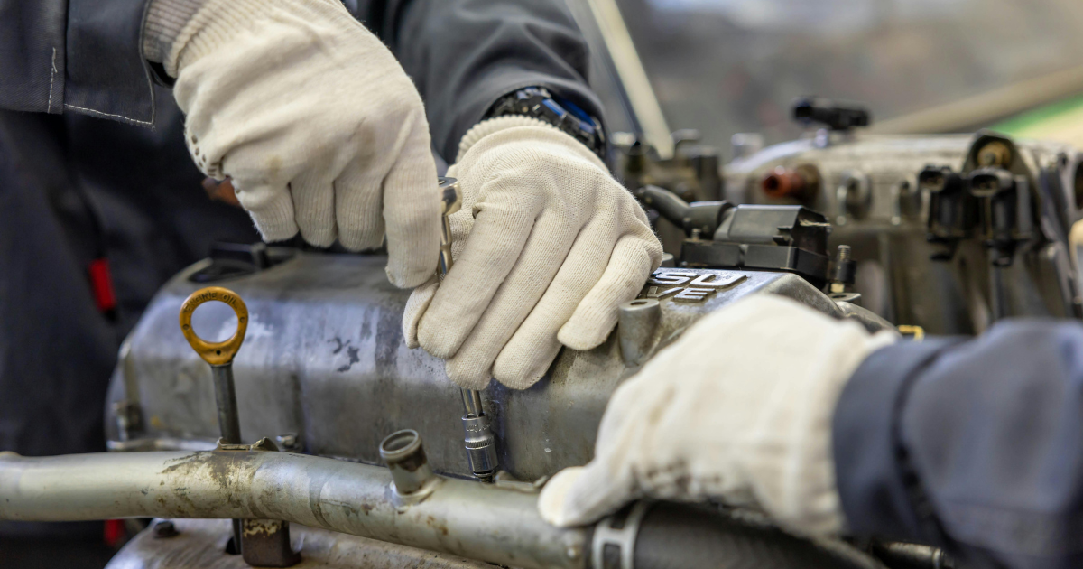 Marine diesel technician performing mobile engine repair.